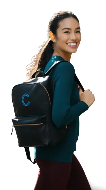 happy woman walking with backpack